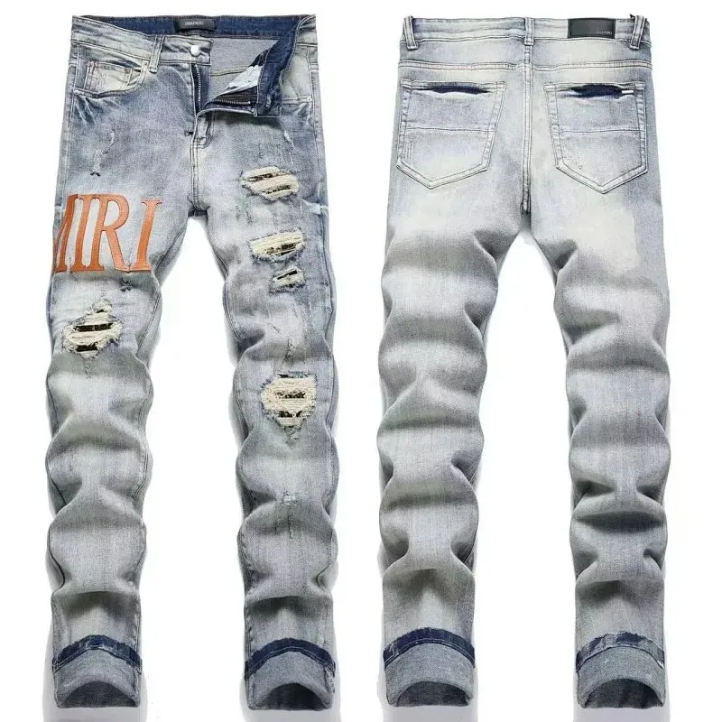 Amiri Logo Ripped Light Wash Jeans Collection